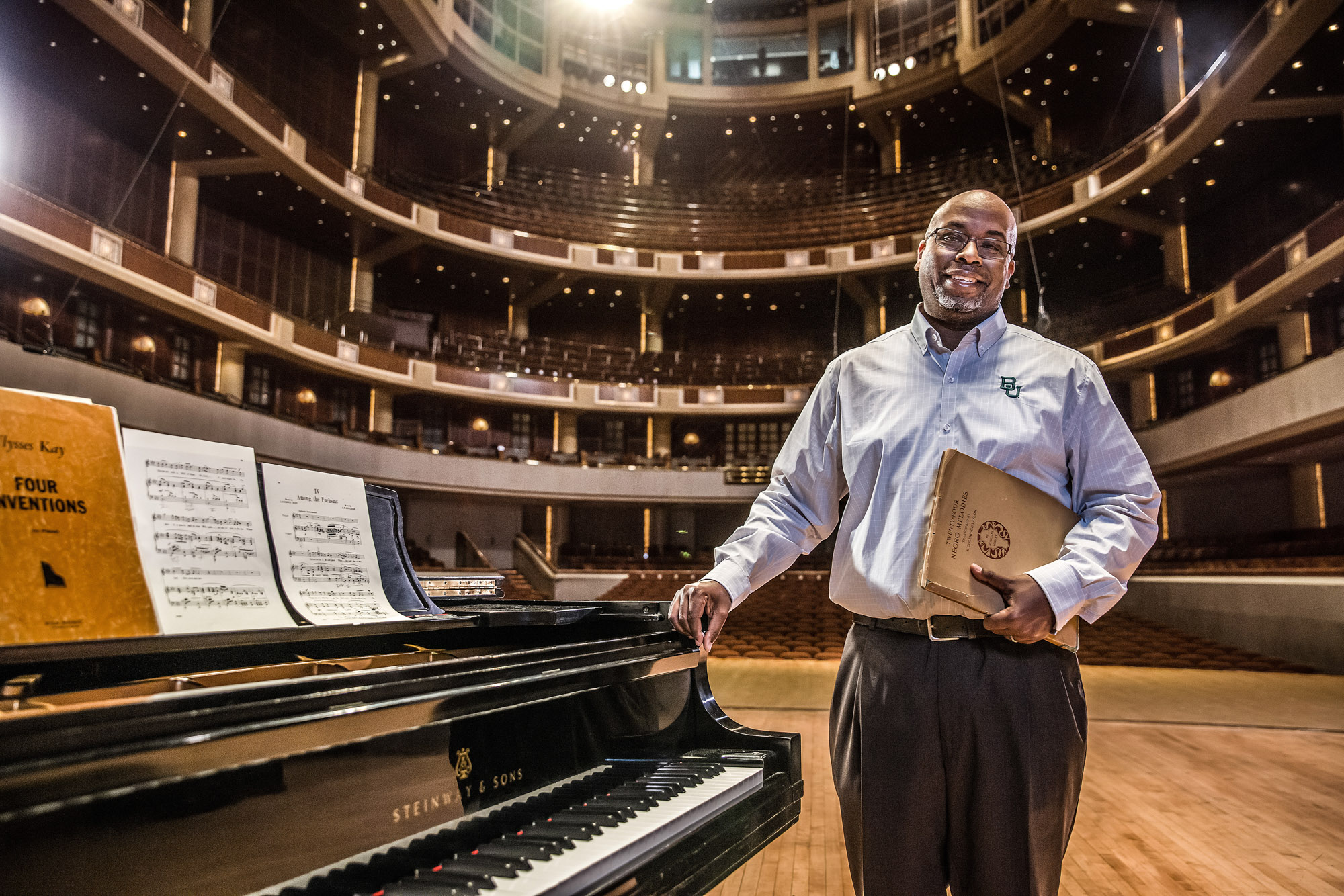 portrait of baylor university professor teacher in meyerson symphony center about music theory on stage with students college waco texas