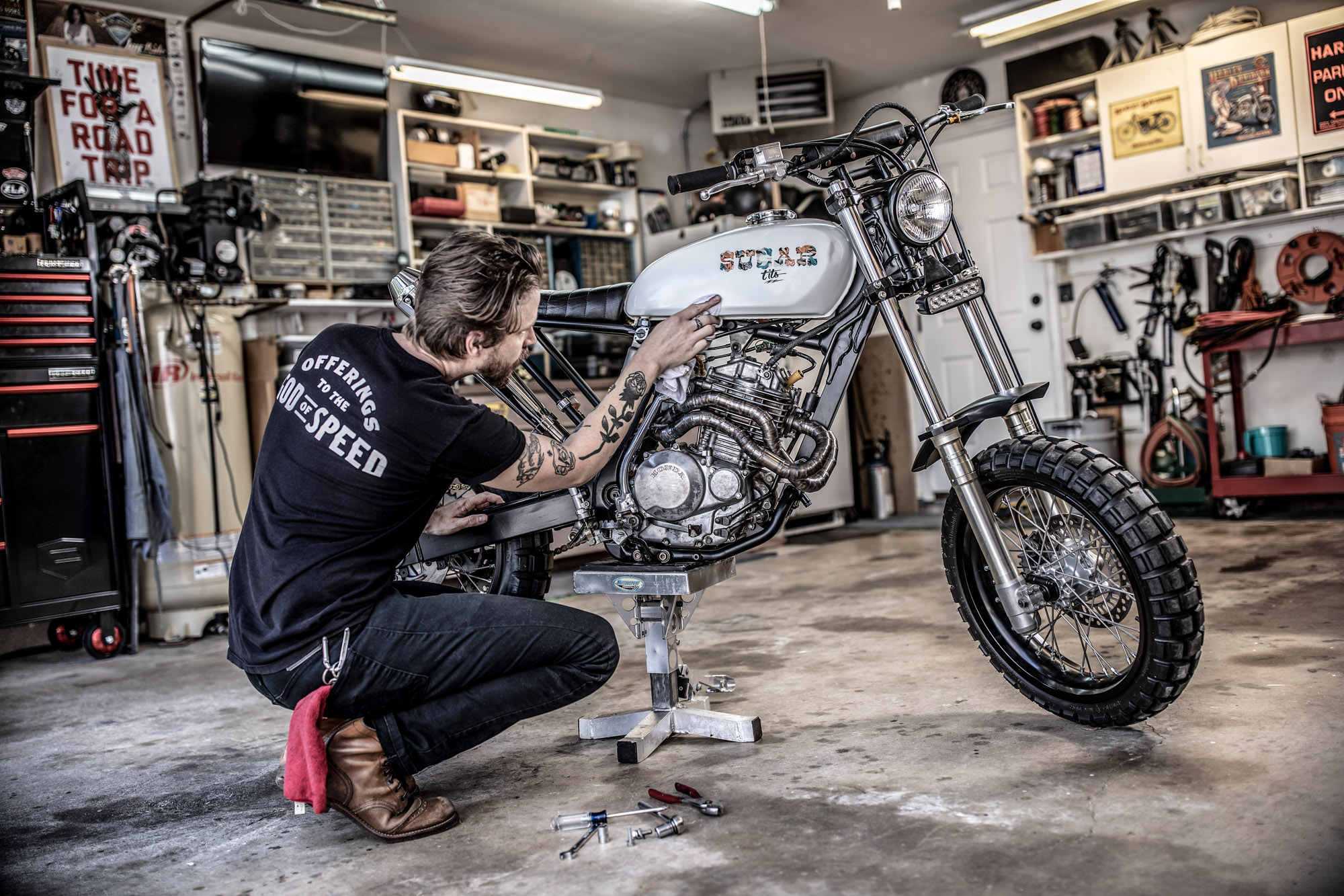man handcrafting a custom motorcycle in his workshop handmade motorcycle bike