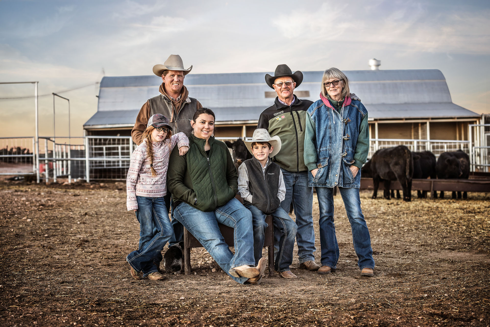 portrait of family farmers at farm ranch ranchers family at sunset sunrise